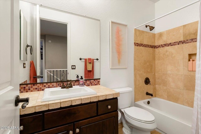 bathroom with toilet, shower / bathing tub combination, decorative backsplash, and vanity