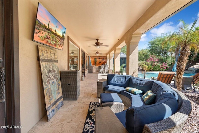 view of patio featuring ceiling fan, an outdoor hangout area, and an outdoor pool