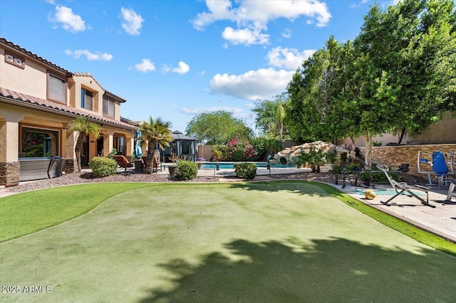 view of yard with an outdoor pool and a patio