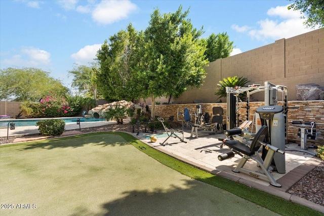 exterior space with a fenced in pool, a patio area, and a fenced backyard