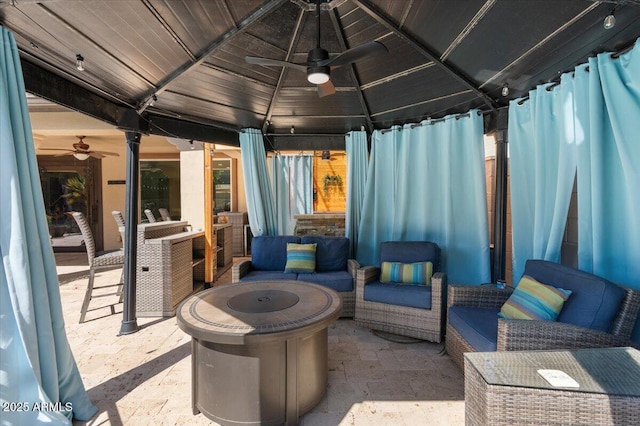 view of patio / terrace featuring a gazebo, outdoor lounge area, and ceiling fan