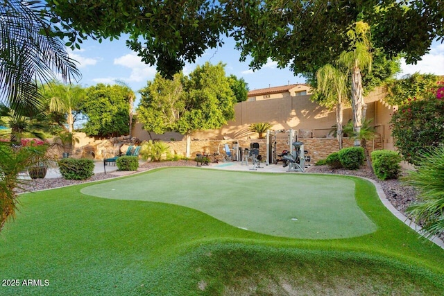 surrounding community featuring a fenced backyard and a patio