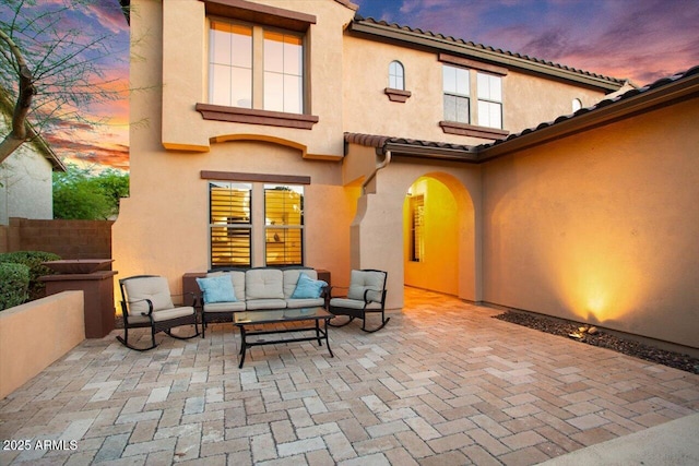 patio terrace at dusk with outdoor lounge area