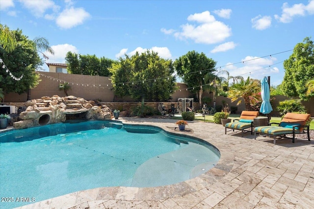 view of swimming pool featuring a patio area, a fenced backyard, and a fenced in pool