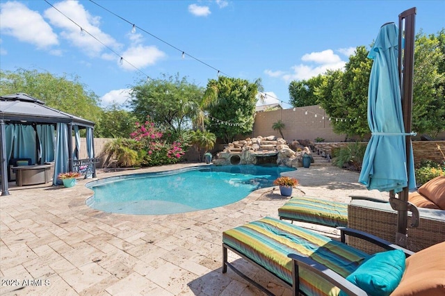 view of swimming pool with a gazebo and a patio area