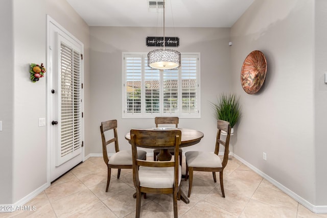 dining space with baseboards, light tile patterned flooring, and visible vents