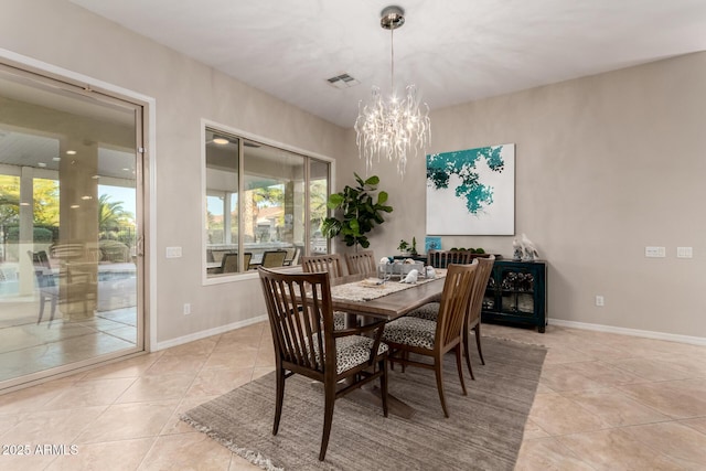 dining room with visible vents, baseboards, a notable chandelier, and light tile patterned flooring