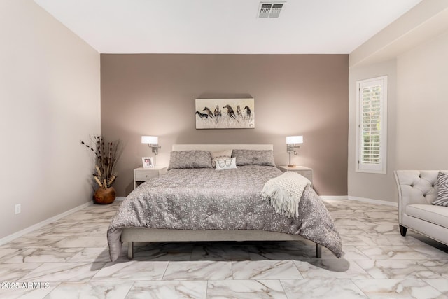 bedroom with baseboards, visible vents, and marble finish floor