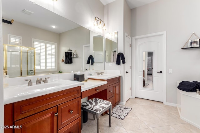 full bathroom featuring double vanity, a sink, a stall shower, and tile patterned floors