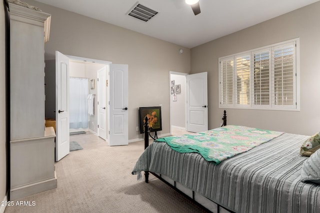 bedroom featuring visible vents, baseboards, ceiling fan, and light carpet