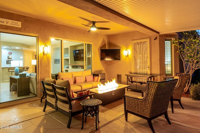view of patio with an outdoor living space with a fire pit and ceiling fan