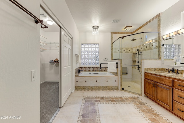 bathroom with vanity, separate shower and tub, and tile patterned floors