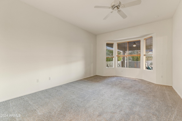 empty room with carpet floors and ceiling fan