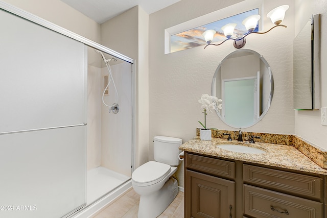 bathroom featuring vanity, toilet, walk in shower, and tile patterned flooring