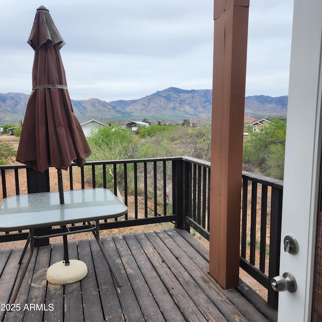 wooden terrace featuring a mountain view