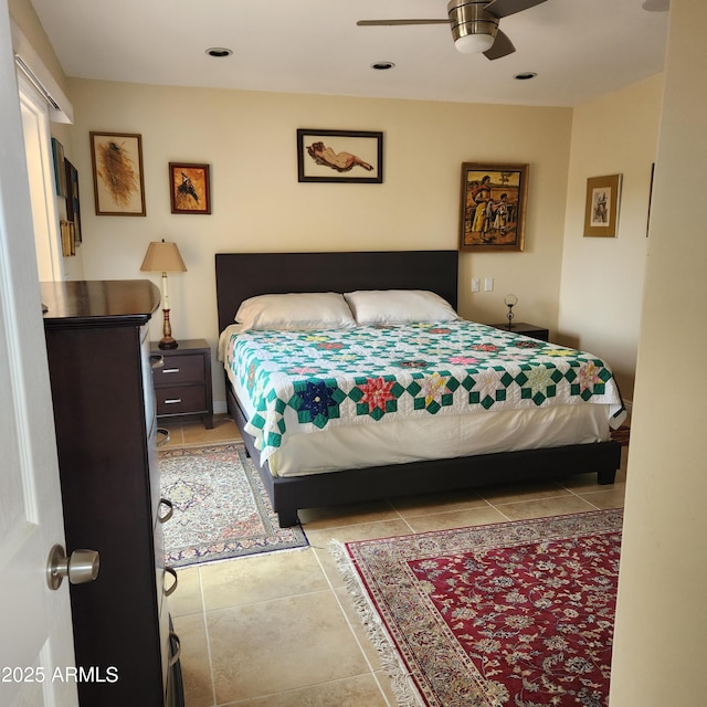 bedroom with light tile patterned floors and ceiling fan