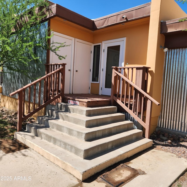 doorway to property with stucco siding
