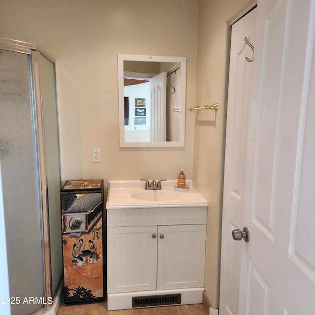 full bath featuring vanity and a shower stall