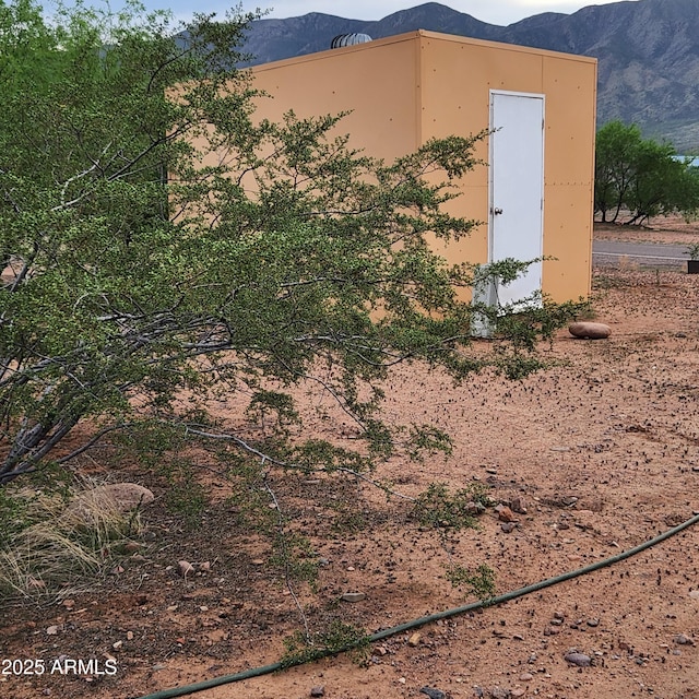 view of outbuilding with a mountain view