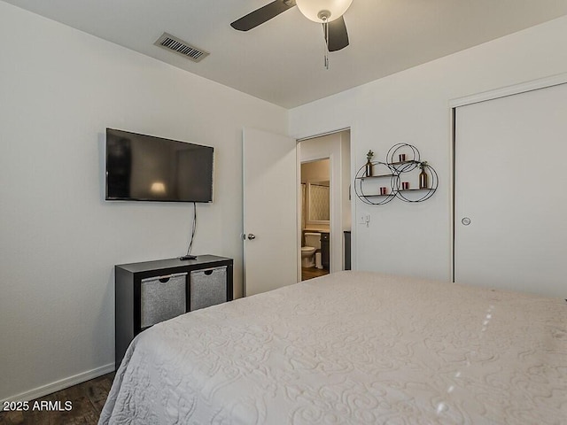 bedroom with baseboards, ceiling fan, dark wood finished floors, and visible vents