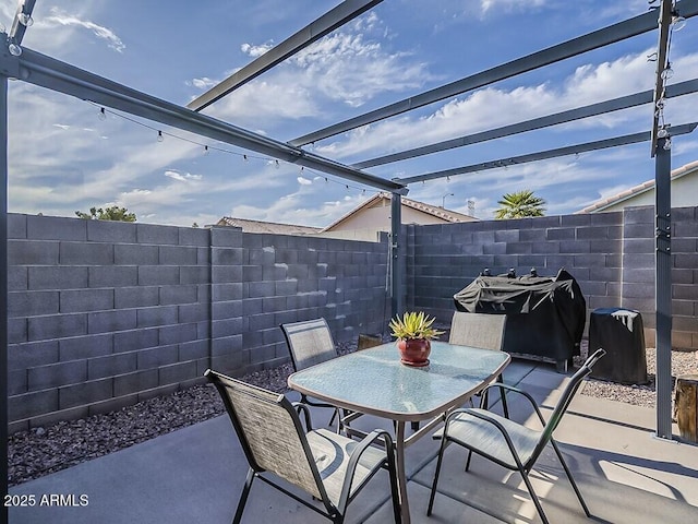 view of patio / terrace featuring a fenced backyard, outdoor dining area, and a grill