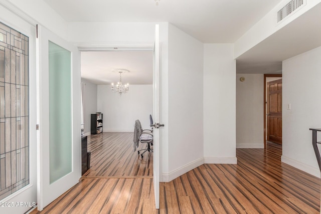 15825 N 45th St, Phoenix, AZ 85032 - hall featuring wood finished floors, a chandelier, and baseboards