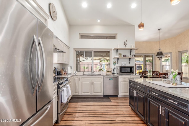 15825 N 45th St, Phoenix, AZ 85032 - kitchen featuring stainless steel appliances, a sink, white cabinetry, light stone countertops, and light wood-type flooring