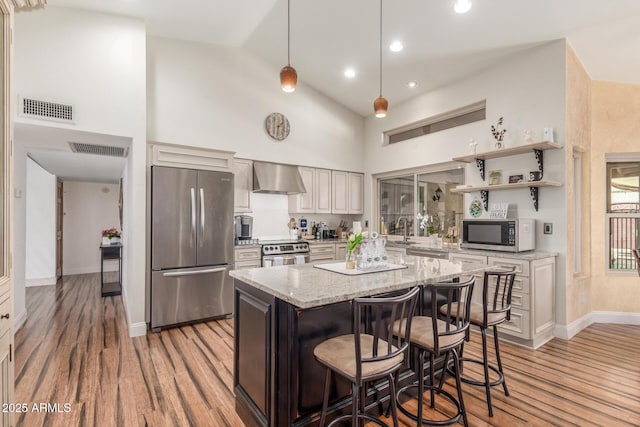 15825 N 45th St, Phoenix, AZ 85032 - kitchen with appliances with stainless steel finishes, wall chimney range hood, high vaulted ceiling, light wood-type flooring, and light stone countertops