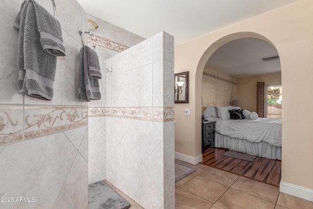 15825 N 45th St, Phoenix, AZ 85032 - ensuite bathroom featuring tile patterned floors, a tile shower, and baseboards