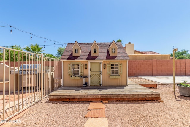 15825 N 45th St, Phoenix, AZ 85032 - view of front of home featuring a fenced backyard, an outbuilding, and a chimney