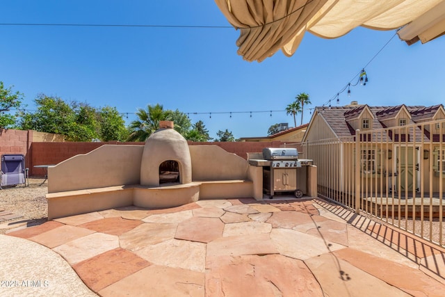 15825 N 45th St, Phoenix, AZ 85032 - view of patio / terrace with exterior fireplace and area for grilling