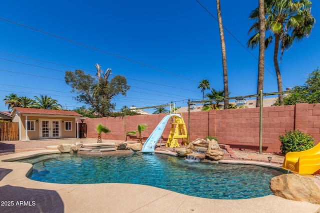 15825 N 45th St, Phoenix, AZ 85032 - view of pool with a water slide, french doors, a fenced backyard, and a patio