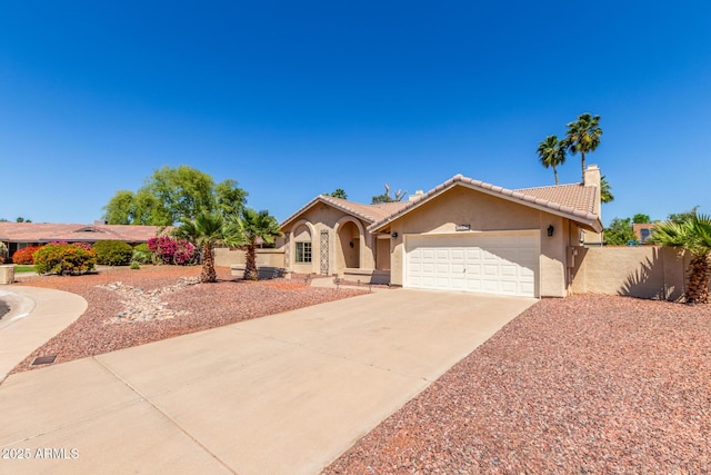 15825 N 45th St, Phoenix, AZ 85032 - mediterranean / spanish-style house with stucco siding, a tiled roof, an attached garage, concrete driveway, and a chimney