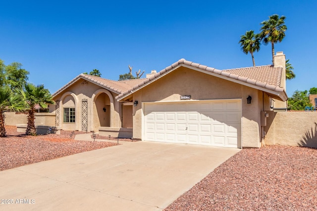 15825 N 45th St, Phoenix, AZ 85032 - mediterranean / spanish-style house featuring stucco siding, an attached garage, driveway, a tiled roof, and a chimney