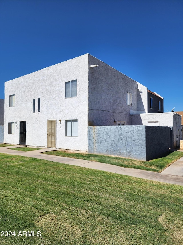 view of home's exterior with a yard