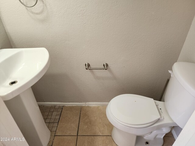 bathroom featuring tile patterned floors and toilet