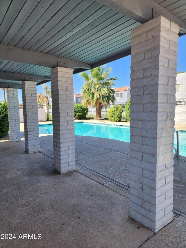 view of pool featuring a patio