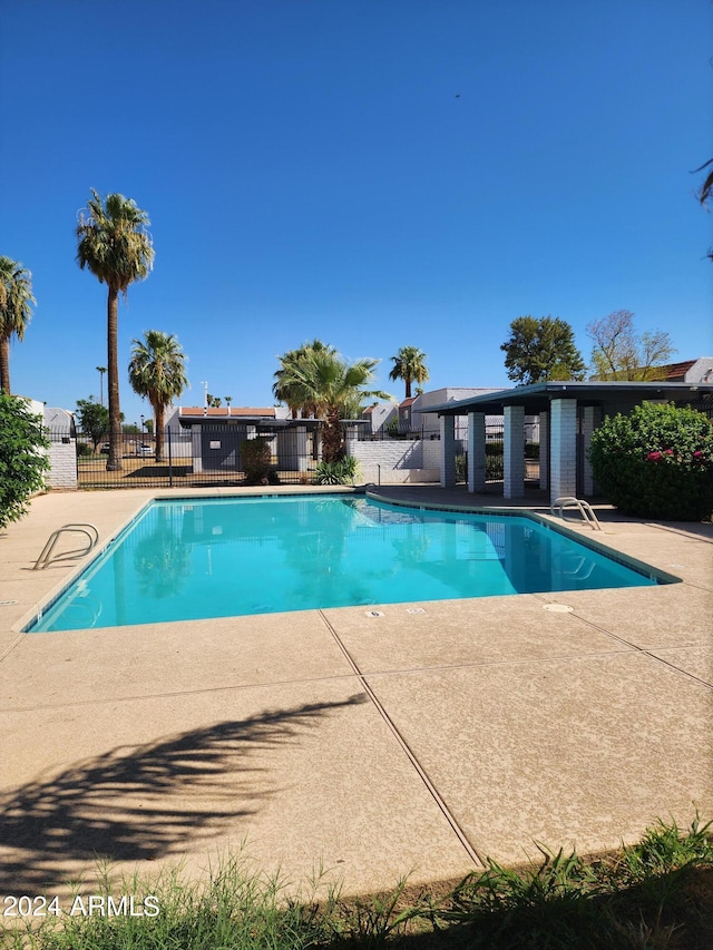 view of swimming pool with a patio