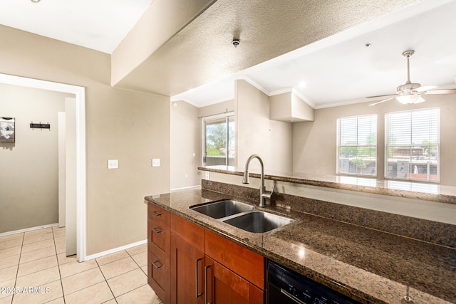 2134 E Broadway Rd Unit 2030, Tempe, AZ 85282 - kitchen featuring a sink, crown molding, brown cabinetry, dark stone countertops, and baseboards