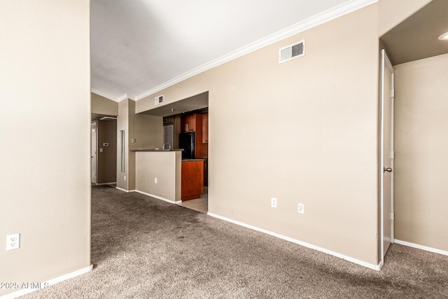 2134 E Broadway Rd Unit 2030, Tempe, AZ 85282 - unfurnished living room with carpet floors, baseboards, and ornamental molding