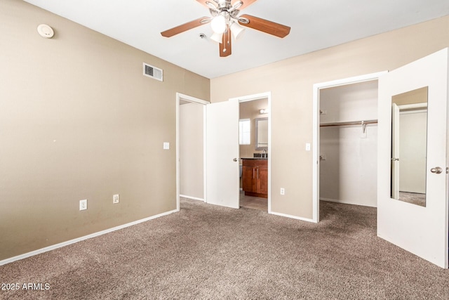 2134 E Broadway Rd Unit 2030, Tempe, AZ 85282 - unfurnished bedroom with carpet flooring, a walk in closet, a closet, and ensuite bath