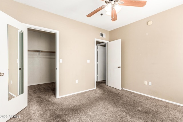 2134 E Broadway Rd Unit 2030, Tempe, AZ 85282 - unfurnished bedroom featuring carpet flooring, a walk in closet, a closet, and baseboards