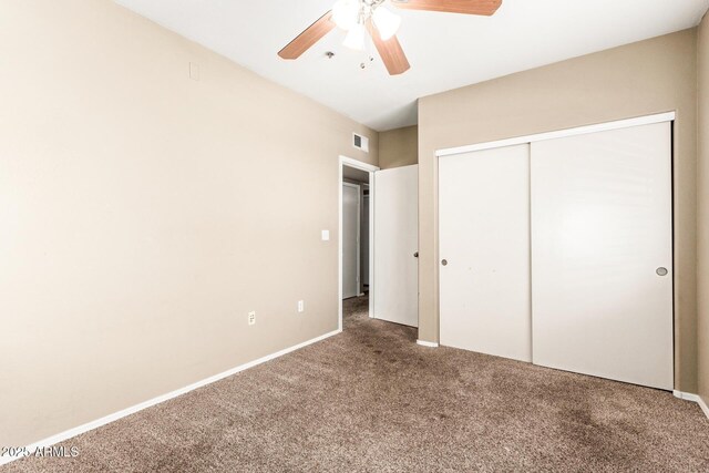 2134 E Broadway Rd Unit 2030, Tempe, AZ 85282 - unfurnished bedroom featuring carpet floors, a closet, a ceiling fan, and baseboards
