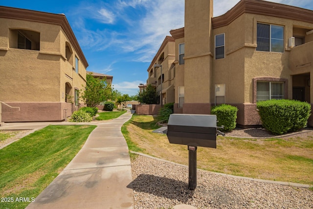2134 E Broadway Rd Unit 2030, Tempe, AZ 85282 - view of property's community featuring a yard