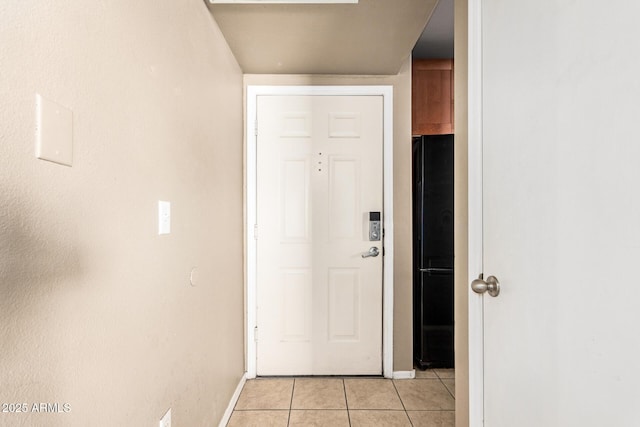 2134 E Broadway Rd Unit 2030, Tempe, AZ 85282 - doorway featuring light tile patterned flooring and baseboards