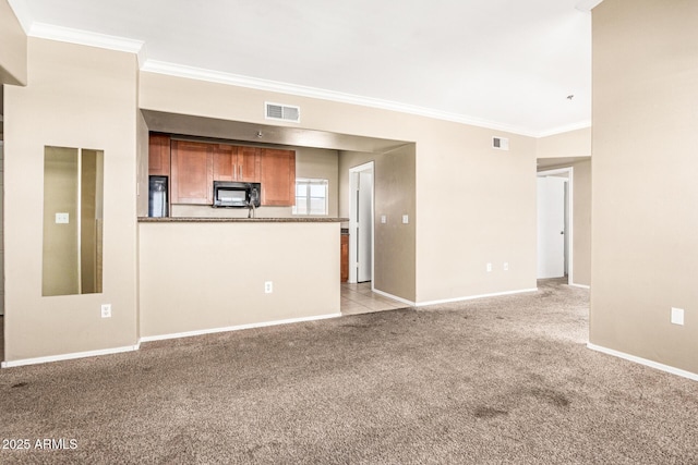 2134 E Broadway Rd Unit 2030, Tempe, AZ 85282 - unfurnished living room featuring crown molding, light carpet, and baseboards