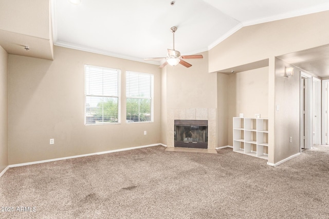 2134 E Broadway Rd Unit 2030, Tempe, AZ 85282 - unfurnished living room featuring carpet flooring, a ceiling fan, ornamental molding, lofted ceiling, and a tile fireplace