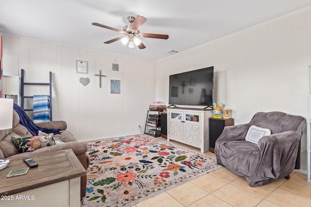 living room with light tile patterned flooring and ceiling fan