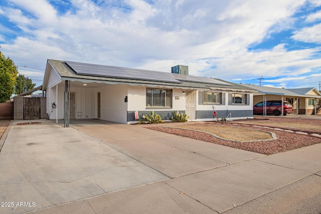 ranch-style home with a carport