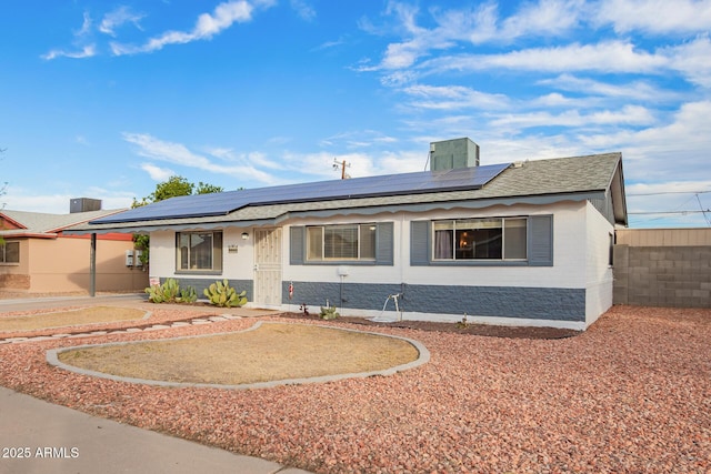 ranch-style house with solar panels